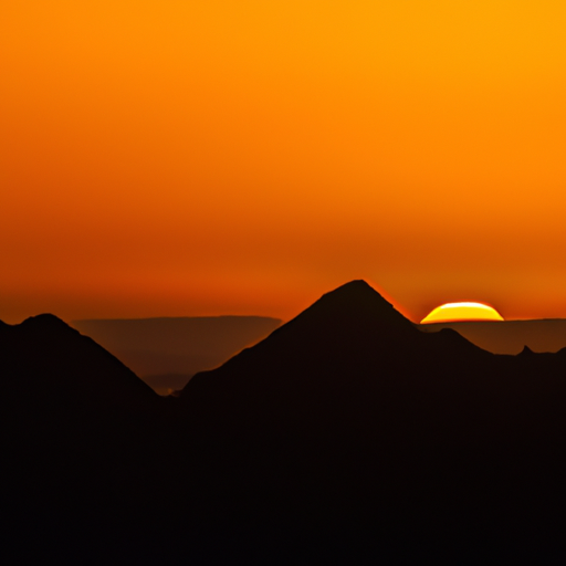 A sunset over the mountain